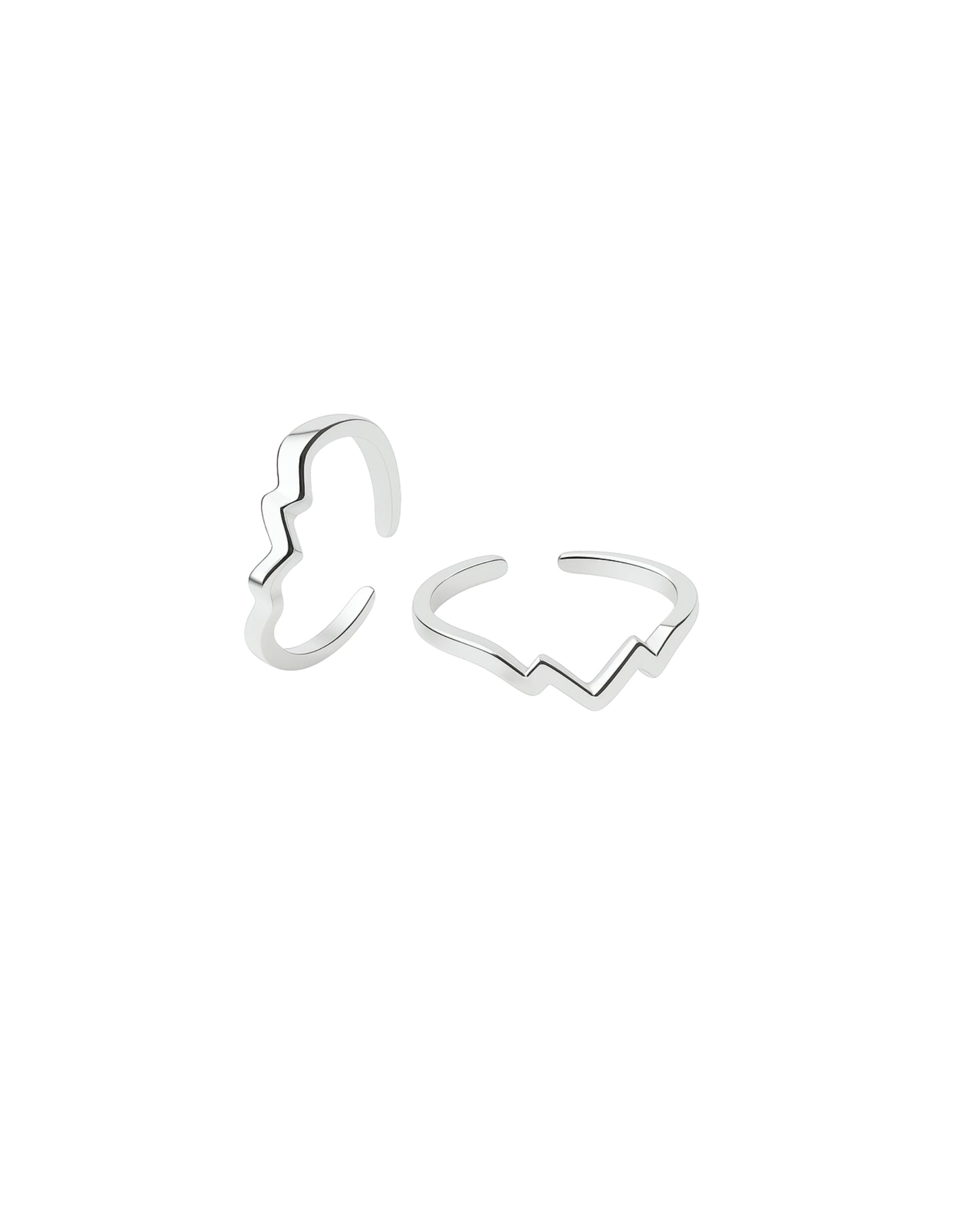 Silver butterfly-shaped open rings on a white background